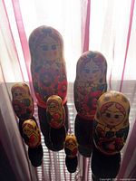 Full set of seven nesting dolls displayed