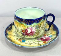Cup and saucer full view showing pattern