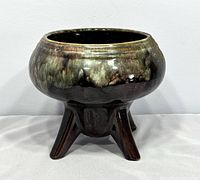 Front angle of Beauce Canada tripod planter showing glaze and legs
