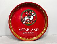Front view of red McFarland tin tray