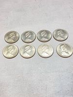 All eight 1969 Canadian dollar coins obverse view