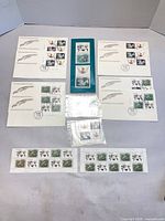 Overall layout showing FDCs, mint panes, presentation card and sleeve