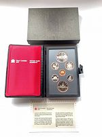Closed presentation case, open holder showing all coins, outer box and certificate