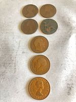 Front view showing all seven halfpenny coins