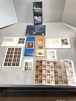 Group shot showing all stamp sheets, booklet, souvenir pages and FDCs