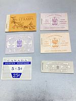 Front covers of five Canadian QEII stamp booklets showing denominations and prices