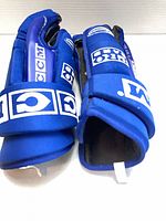 Overall view of both gloves showing blue exterior and CCM branding