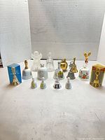 Group shot of all sixteen bells and two boxes