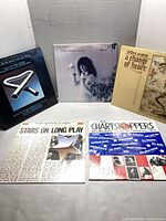All five LP covers displayed upright