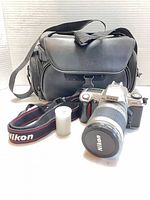 Camera, lens, strap, film roll, Case Logic bag