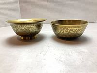 Both bowls side view showing engraving and foot ring