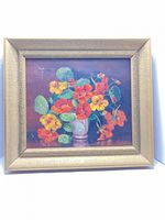 Front view of framed oil painting depicting flowers