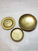 Overview of three brass trinket dishes
