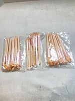 Three sealed packs of makeup brushes, full lot view
