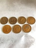 Group shot of all seven pennies obverse side
