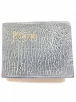 Front cover showing textured black faux leather and gold "Photographs" script