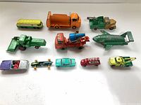 Group shot showing 11 visible die-cast vehicles in three rows
