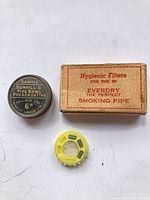 Group shot showing Dunhill tin, Everdry filter box, yellow plastic filter piece