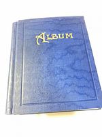 Front cover of blue album with gold title