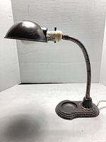 Full view of lamp showing shade, neck and base