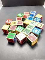 Group of 24 wooden alphabet blocks