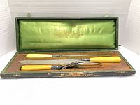 Open case showing knife, fork, steel, interior satin and exterior wear