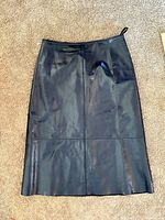 Front view of black leather midi pencil skirt