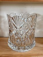 Full view of clear cut-glass vase/ice bucket showing scalloped rim and pattern