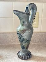 Full front view of hand-painted ceramic pitcher-vase