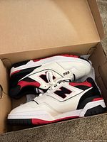 Pair of New Balance 550 sneakers in box, showing overall appearance and colorway