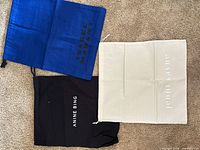 Group shot of all three branded cotton dust bags