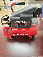Full view of Craftsman 3 gal air compressor showing tank, motor housing, gauge, handle
