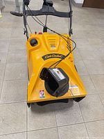 Front top view showing Cub Cadet branding, fuel cap, control panel and chute