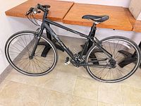 Full left side view of black Gary Fisher hybrid bike