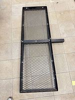 Full view of rectangular steel mesh cargo carrier with 2" shank attached