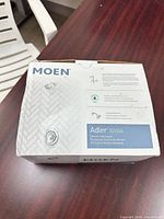 Sealed Moen Adler 82604 retail box, front view showing product details