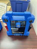 Front view of blue NPower Powerpack showing controls, work light, specifications, and overall condition