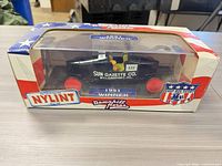 Front view of boxed model showing car, branding and 1951 Winner label