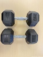 Top view of matched pair of 40 lb rubber hex dumbbells showing heads and chrome handles