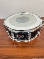 12" black PDP Z Series tom drum, top view showing Evans head and chrome hardware