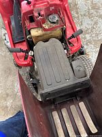 Top view of mower showing fuel tank, engine cover, seat and deck