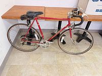 Full left-side view of red Schwinn road bike