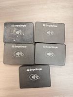 Front view showing SwipeSimple branding and contactless symbol on five units