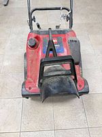 Front view of Toro CCR 2450 showing chute and housing