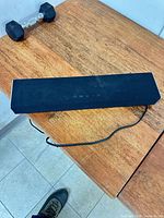Top view of Vizio black soundbar with power cable