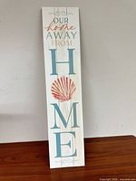 Front view of wooden coastal wall sign