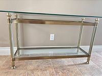 full view showing brass finish frame, glass top and lower shelf