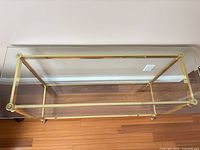 Top view showing rectangular brass frame and clear glass panel