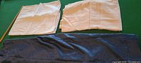 All three folded tablecloths displayed