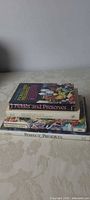 Stack of four preserving books